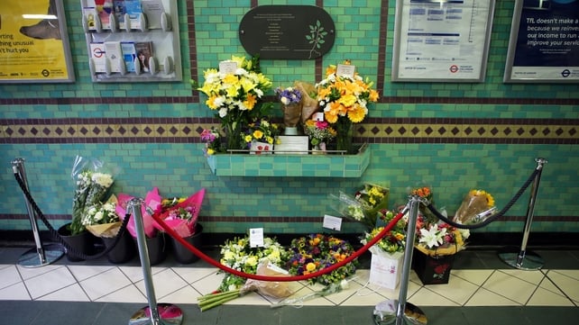 Flowers left by the 7 July memorial plaque at Aldgate Station, London, with the names of those who were killed in the bombings at the station