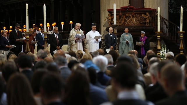 Members of various religious groups pray during a service in St Paul's Cathedral