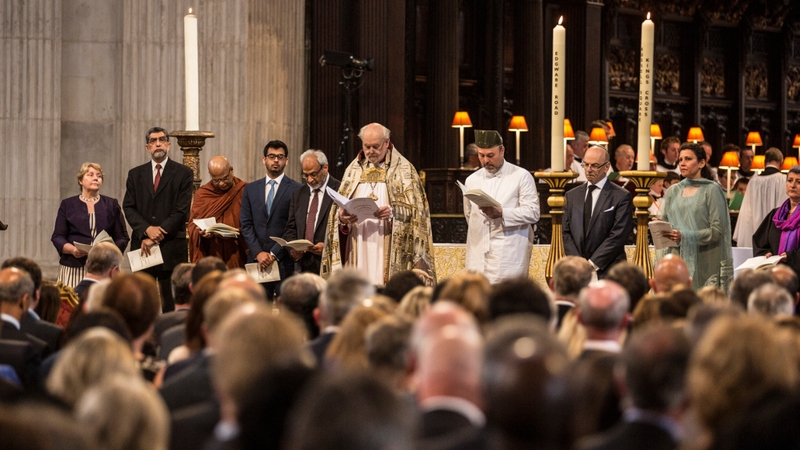 Bishop of London Richard Chartres stands with representatives of the world's religions in St Paul's Cathedral