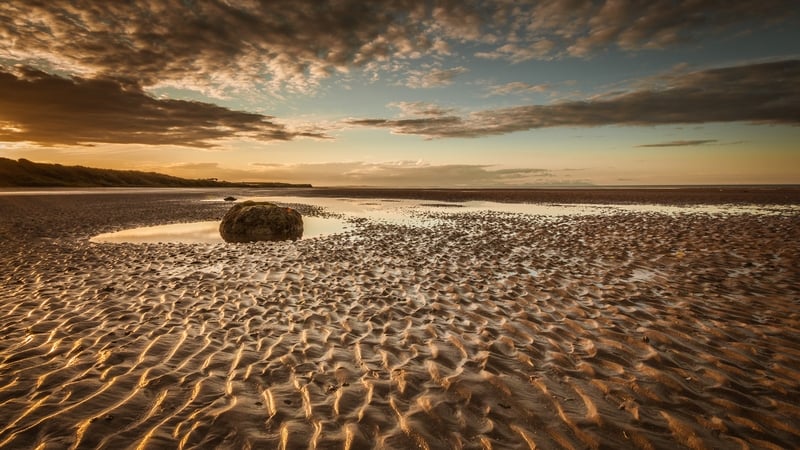 "Geoscientists use unique fingerprints held within individual grains to piece together the history of sands in rivers, beaches and deserts" Photo: Gormanstown beach at sunset by Tony Mullen