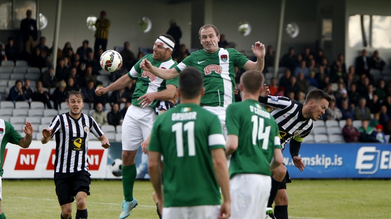 Cork City's Mark O'Sullivan and Colin Healy both going for the ball