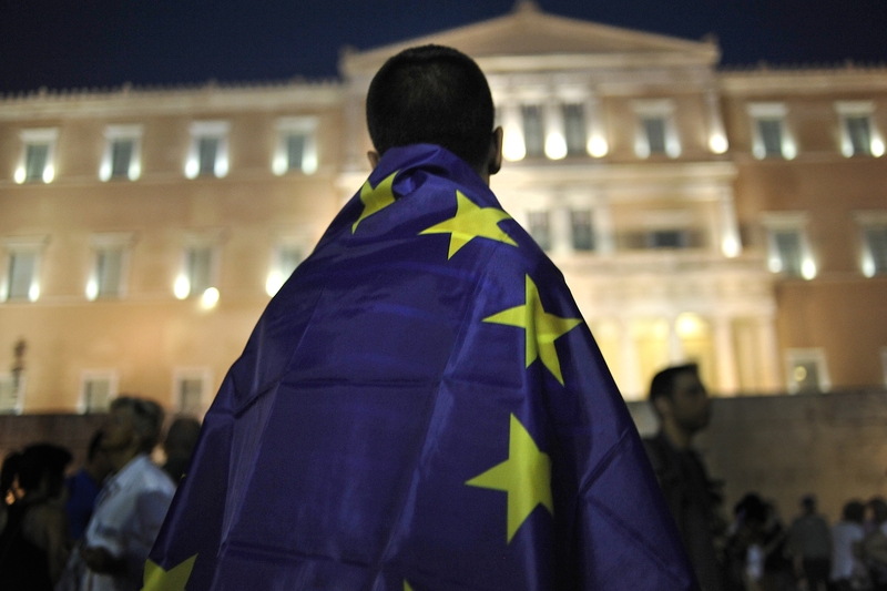 Greeks wait outside parliament to see if reforms will be approved