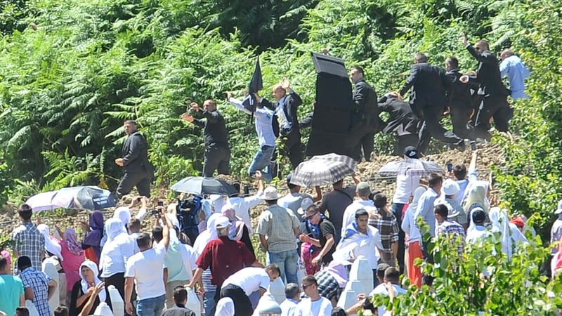 Angry mourners threw bottles and stones at Aleksandar Vucic before he fled the ceremony