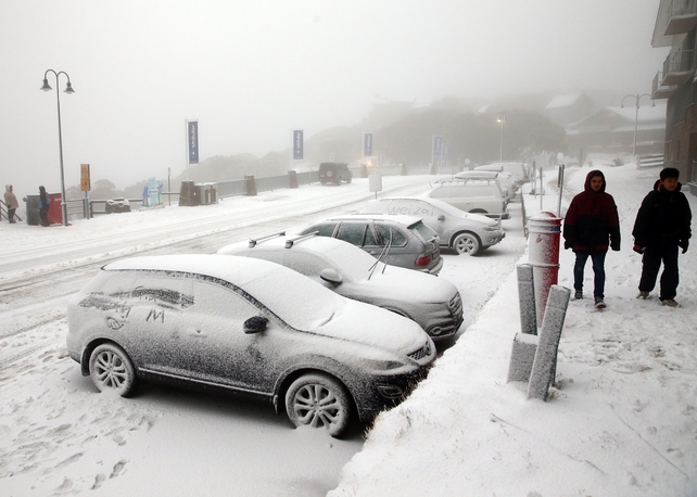 Cars are seen covered in snow during a cold snap in Mount Buller, Australia.