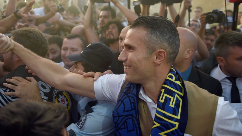 Robin van Persie is greeted by Fenerbahce fans at Sabiha Gokcen International Airport