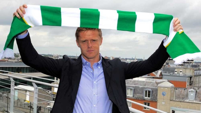 Damien Duff poses with the Shamrock Rovers colours after signing for the Tallaght club