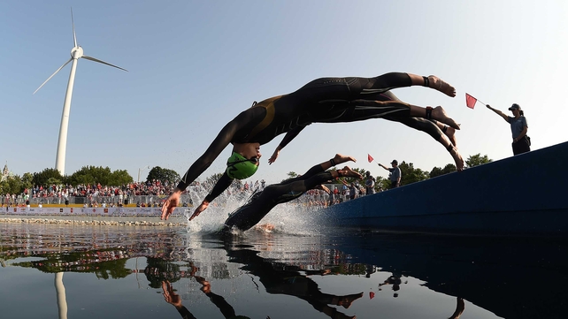 Claudia Rivas of Mexico dives into the water at the start of the women's triathlon at Ontario Place during the during the 2015 Pan American Games