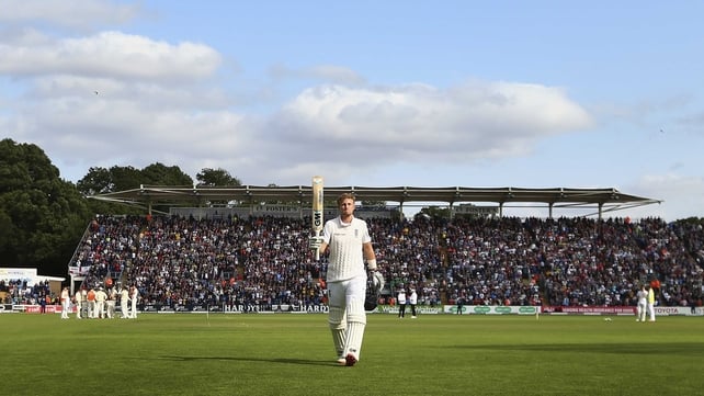 Joe Root of England raises his bat as he leaves the field after being dismissed for 134 runs by Mitchell Starc of Australia during day one of the 1st Investec Ashes Test match between England and Australia