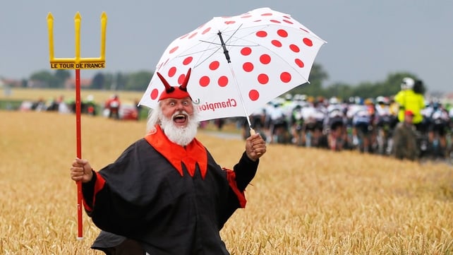 Dieter 'Didi' Senft, the self-styled 'Devil' of the Tour de France, cheers on the riders during stage five - a 189.5km stage between Arras and Amiens