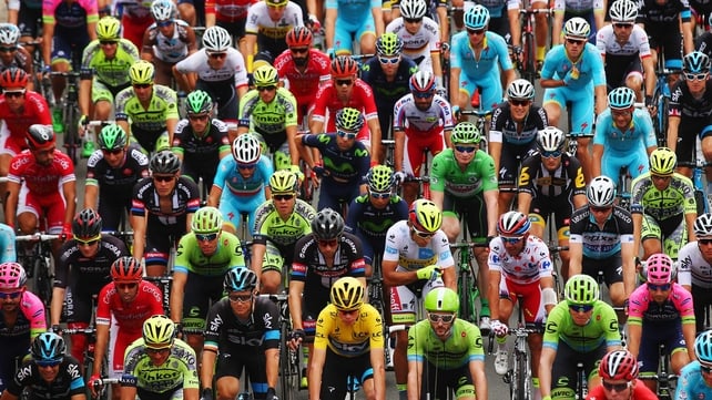 The peloton rides at the start of stage four of the 2015 Tour de France - a 223.5km stage between Seraing and Cambrai