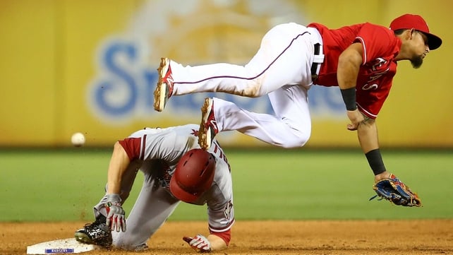 AJ Pollock of the Arizona Diamondbacks slides safely to second base before the tag of Rougned Odor of the Texas Rangers in the sixth innings during a game at Globe Life Park in Arlington, Texas