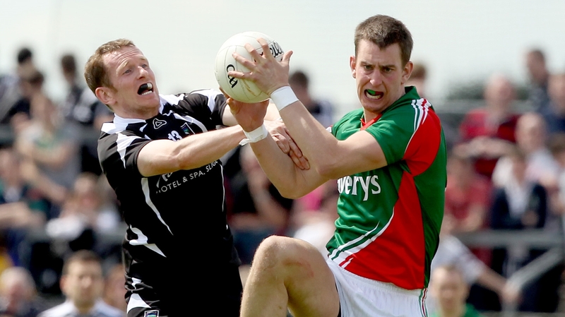 Sligo's Mark Breheny and Barry Moran of Mayo in action during the 2012 Connacht final between the sides