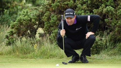 Padraig Harrington lines up a putt on the ninth hole at St Andrews