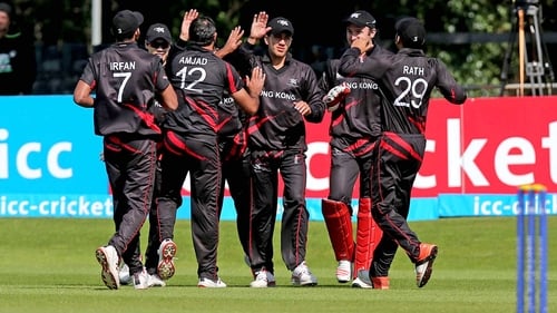Hong Kong players celebrate taking the wicket of Ireland's Andrew Balbrine