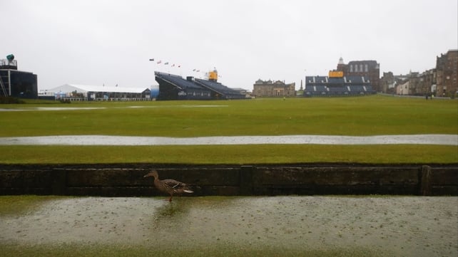 Nice weather for a duck as the first day of the Open Championship is wrecked by rain in Scotland