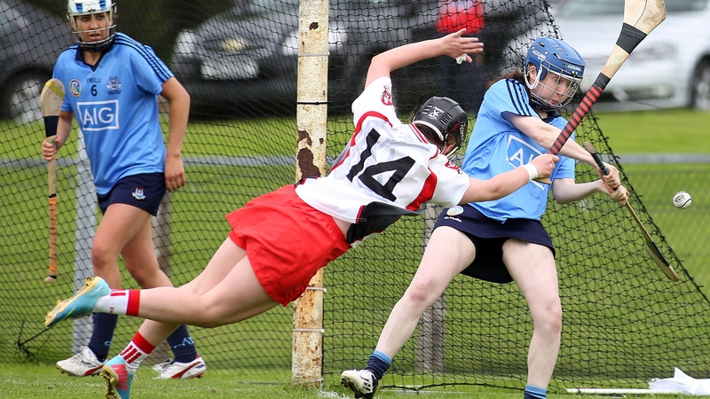 Dublin's Sile Nic Coitir clears under fierce pressure from Mary Kelly of Derry