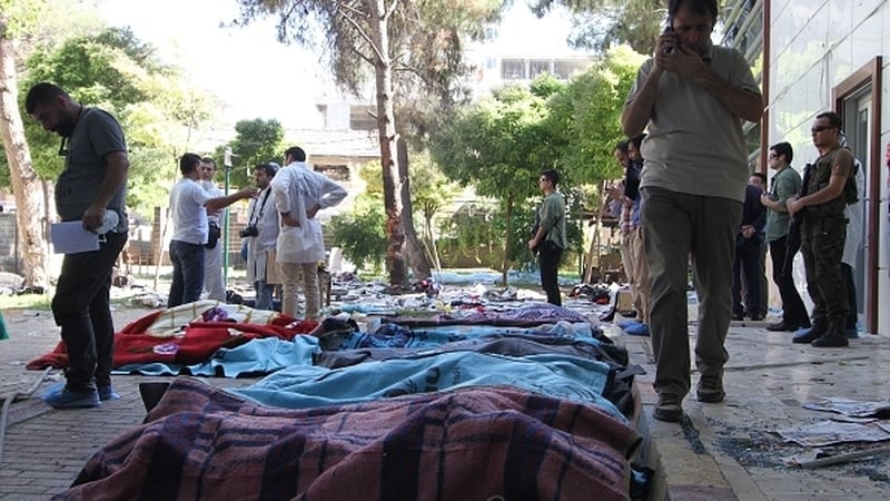 Bodies were covered with blankets at the site of the explosion