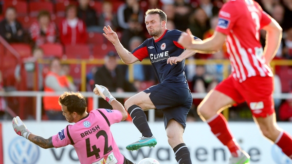 Sligo goalkeeper Richard Brush saves from Conan Byrne