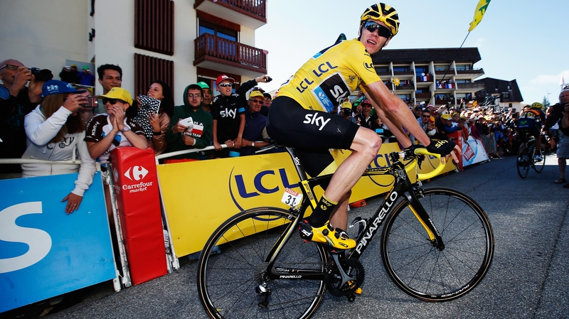 Chris Froome checks the finish times at the end of the twentieth stage