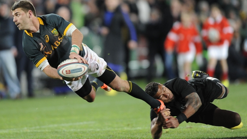 South Africa's Willie le Roux is tackled by Charles Piutau of New Zealand