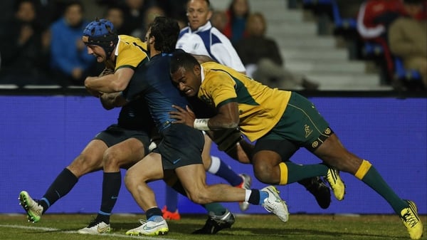 Dean Mumm crashes over the whitewash for Australia's second try at Estadio Malvinas Argentinas
