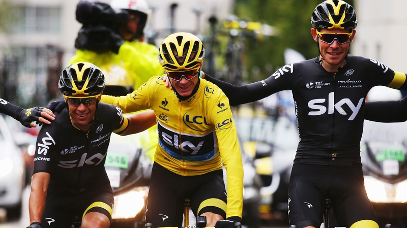 Chris Froome of Team Sky celebrates overall Tour de France victory with team-mates Richie Porte (L) and Luke Rowe