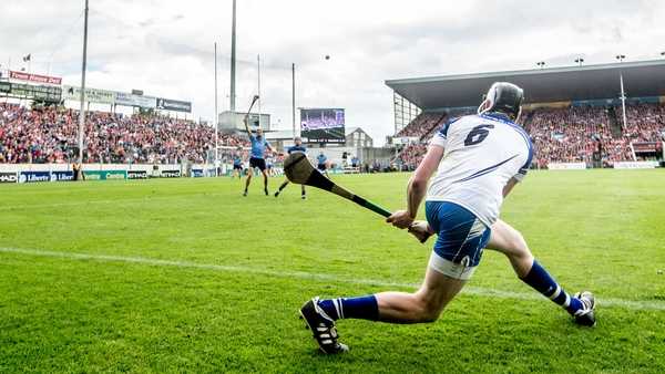 Waterford's Austin Gleeson attempts a side line puck against Dublin