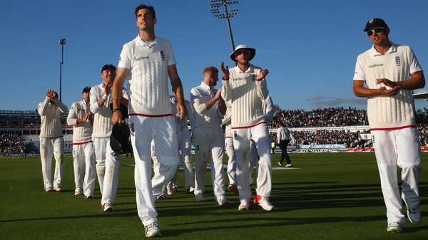 Steven Finn is applauded off the pitch by his England team-mates at the end of play at Edgbaston