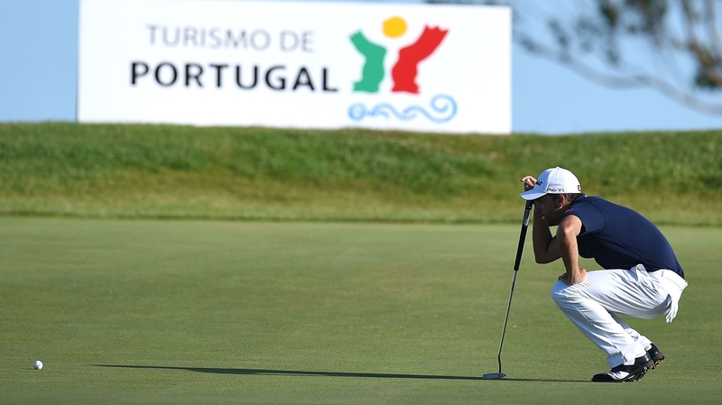 Antonio Hortal of Spain lines up a putt on the 17th green