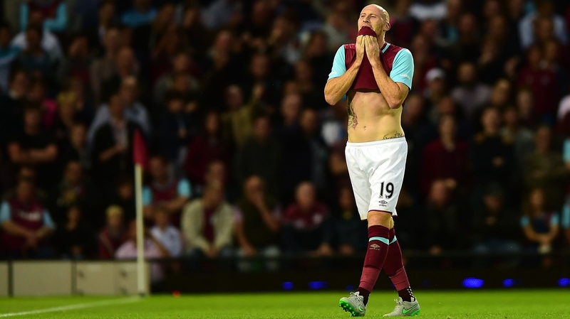 James Collins of West Ham leaves the field after being shown a red card