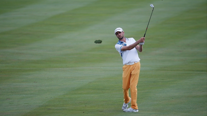 Troy Merritt hits his second shot on the 14th