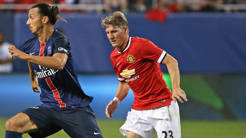 Bastian Schweinsteiger tracks Zlatan Ibrahimovic of PSG during a friendly in Chicago