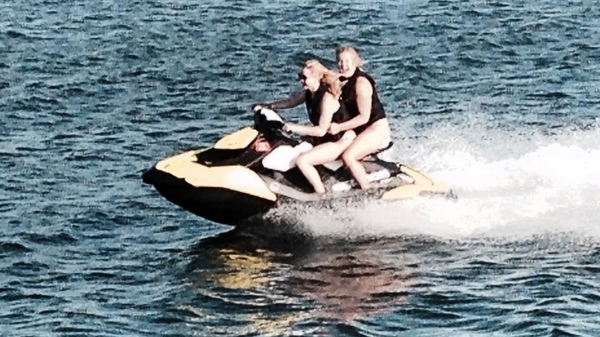 Amy Schumer and Jennifer Lawrence jet skiing, image via Amy Schumer/Instagram