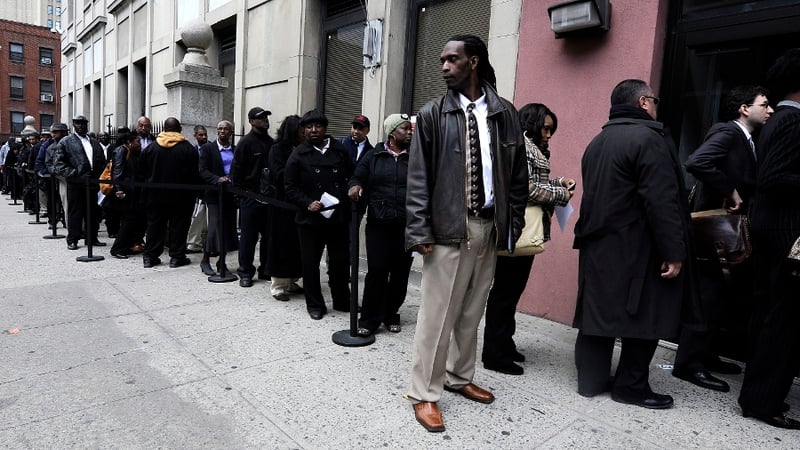 The US economy added 215,000 jobs last month, down from an upwardly revised 231,000 in June