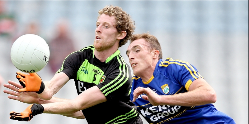 Kerry's Brendan O'Sullivan and Padraic Ferrick of Mayo