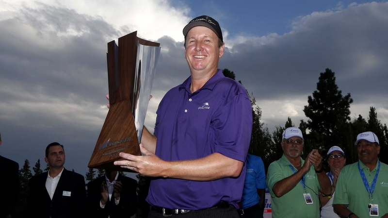 JJ Henry hoists the Barracuda Championship trophy following his play-off win in Reno, Nevada