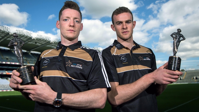 Monaghan's Conor McManus (L) and Galway's Jonathan Glynn with their awards