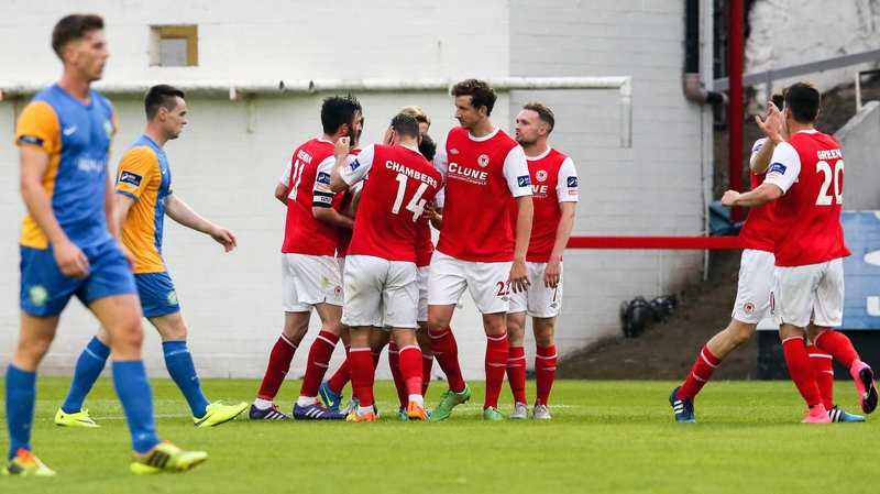 Greg Bolger is mobbed by his team-mates after scoring what turned out to be the winner