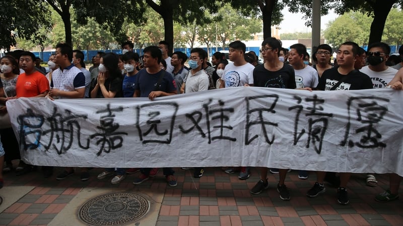About 200 angry protesters gathered outside a hotel where officials were briefing journalists