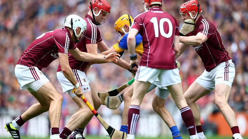 Galway's Jason Flynn, Jonathan Glynn, Conor Whelan and Joe Canning surround Shane McGrath of Tipperary