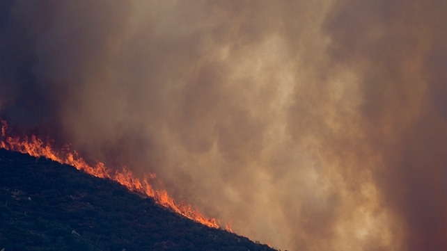 Fire makes a run up a ridge at the Cabin Fire in the Angeles National Forest, California