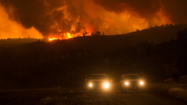 Flames spread on a hilltop as a fire burns near Clearlake, California