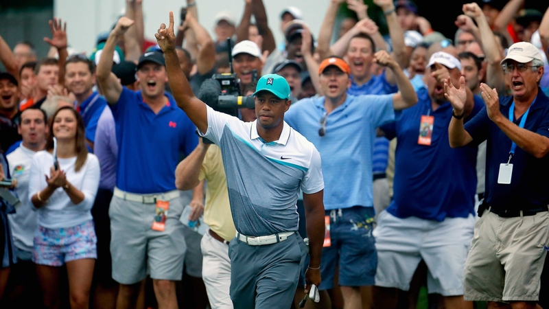 Fans in Greensboro react raucously to Tiger Woods' chip-in birdie on the 10th hole at Sedgefield Country Club