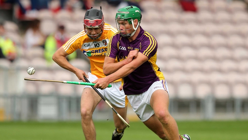Wexford's Conor McDonald evades Antrim's Maoi Connolly