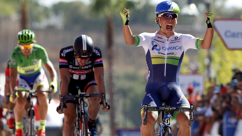 Caleb Ewan crosses the line to claim his first Grand Tour stage win