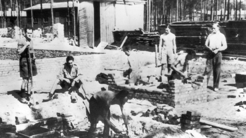 Captured RAF officers at Stalag Luft 3 lay the foundations for a new hut