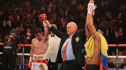 Anthony Crolla and Darleys Perez have their arms raised as their WBA World Lightweight Championship contest is announced a draw