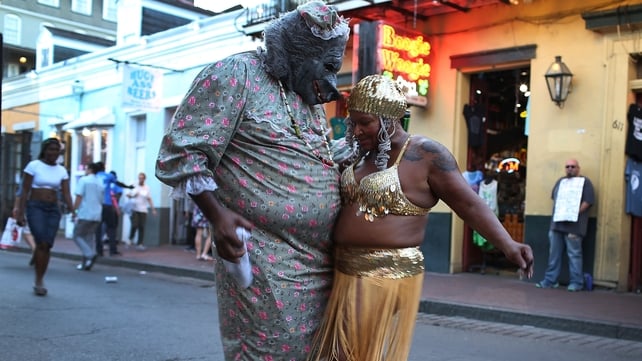 Ghetto Priest (L) and Marie Francois dance together in the French Quarter during commemoration events to mark 10 years since Hurricane Katrina