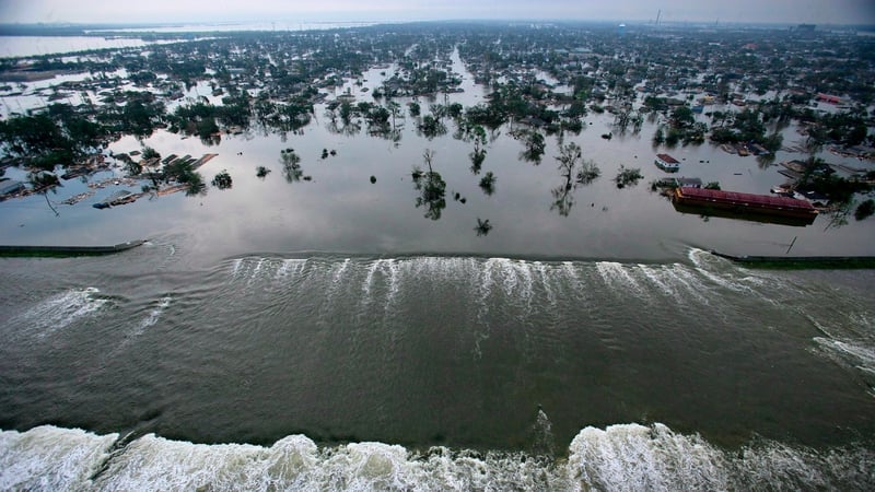 A levee along the Inner Harbor Navigational Canal being broken in the aftermath of Hurricane Katrina and allowing water to flow towards New Orleans