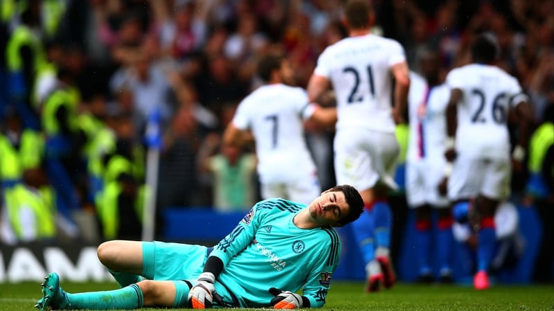 Thibaut Courtois lies defeated following Palace's first